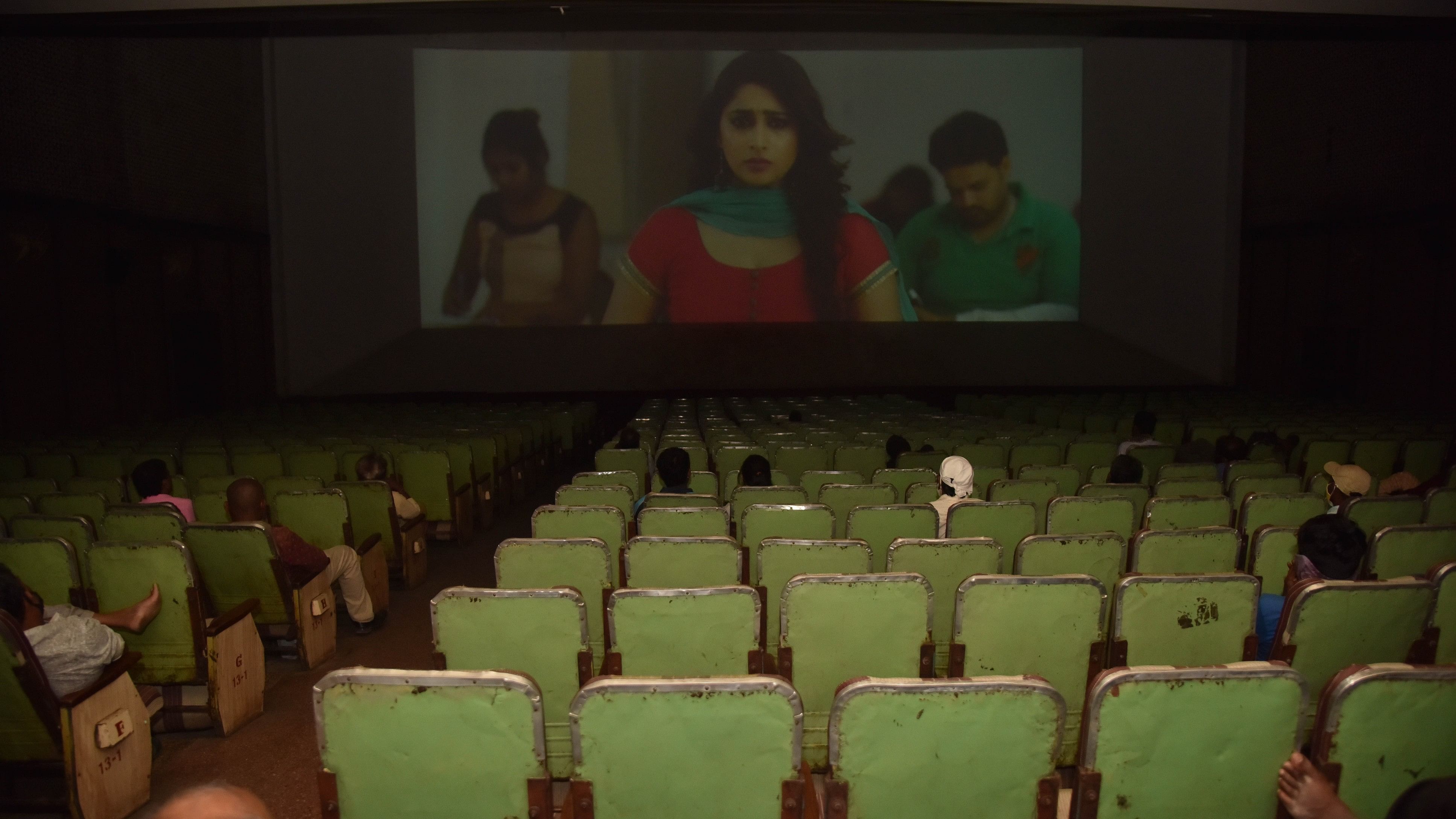 <div class="paragraphs"><p>People watch new movie at the Santhosh theatre in Bengaluru</p></div>